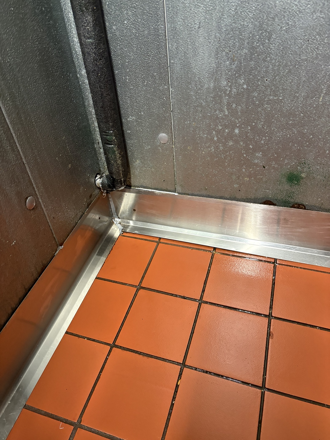 After commercial tile and stainless corner detail cleaning