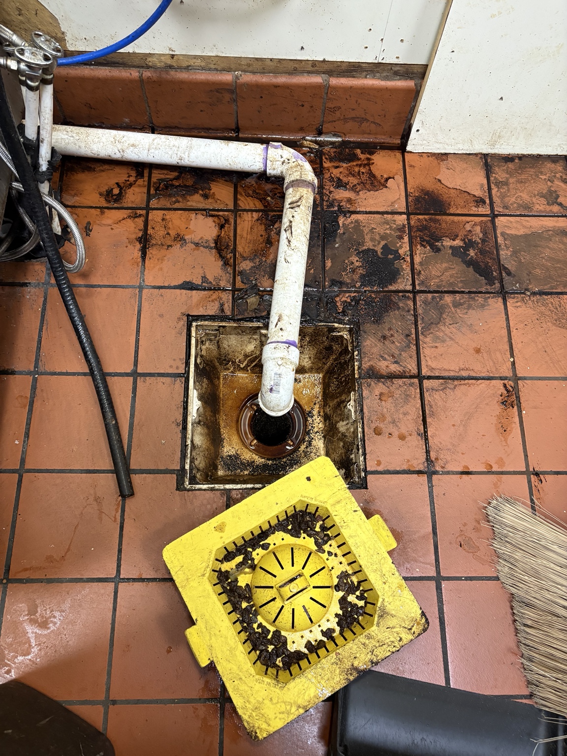 Before commercial floor and drain detail restoration